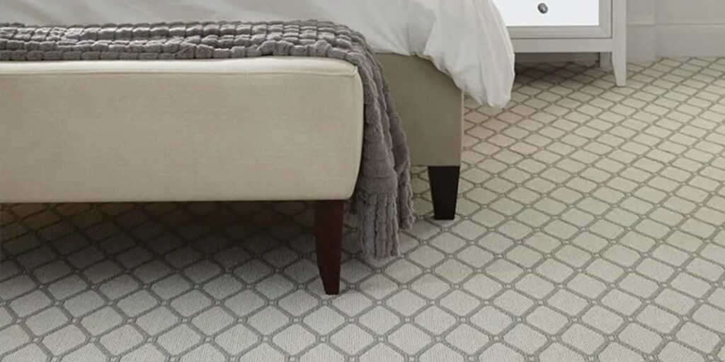 Patterned carpet in bedroom